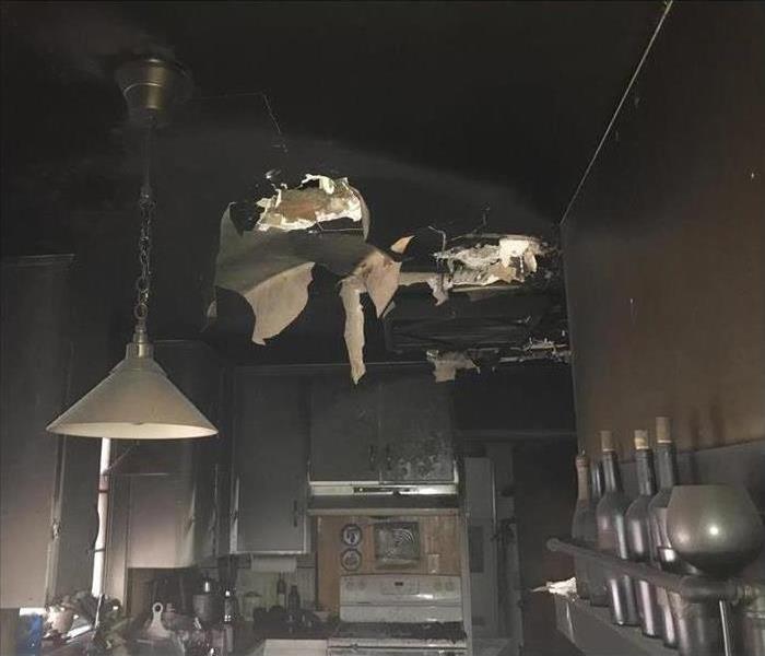burned kitchen, ceiling collapsed, content with smoke damage